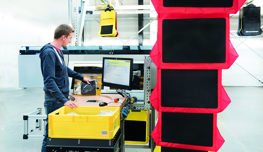Warehouse worker scans the SKU barcode of an apparel item during order sorting process